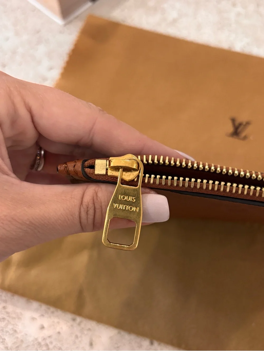 Authentic Louis Vuitton Neverfull Empreinte GM cognac pouch wristlet